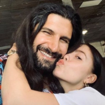 Talitha Stone about to kiss her rumored husband, Kavyan Novak.